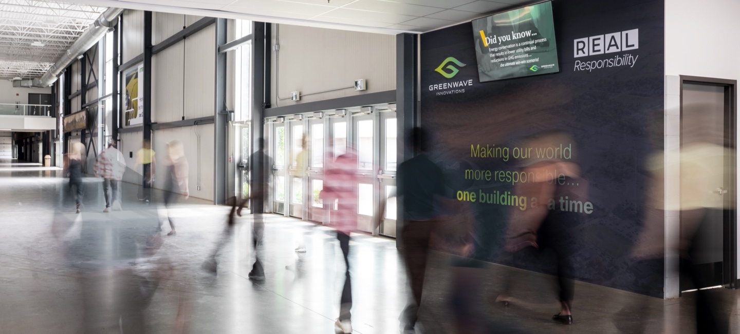 people walking inside a building hallway